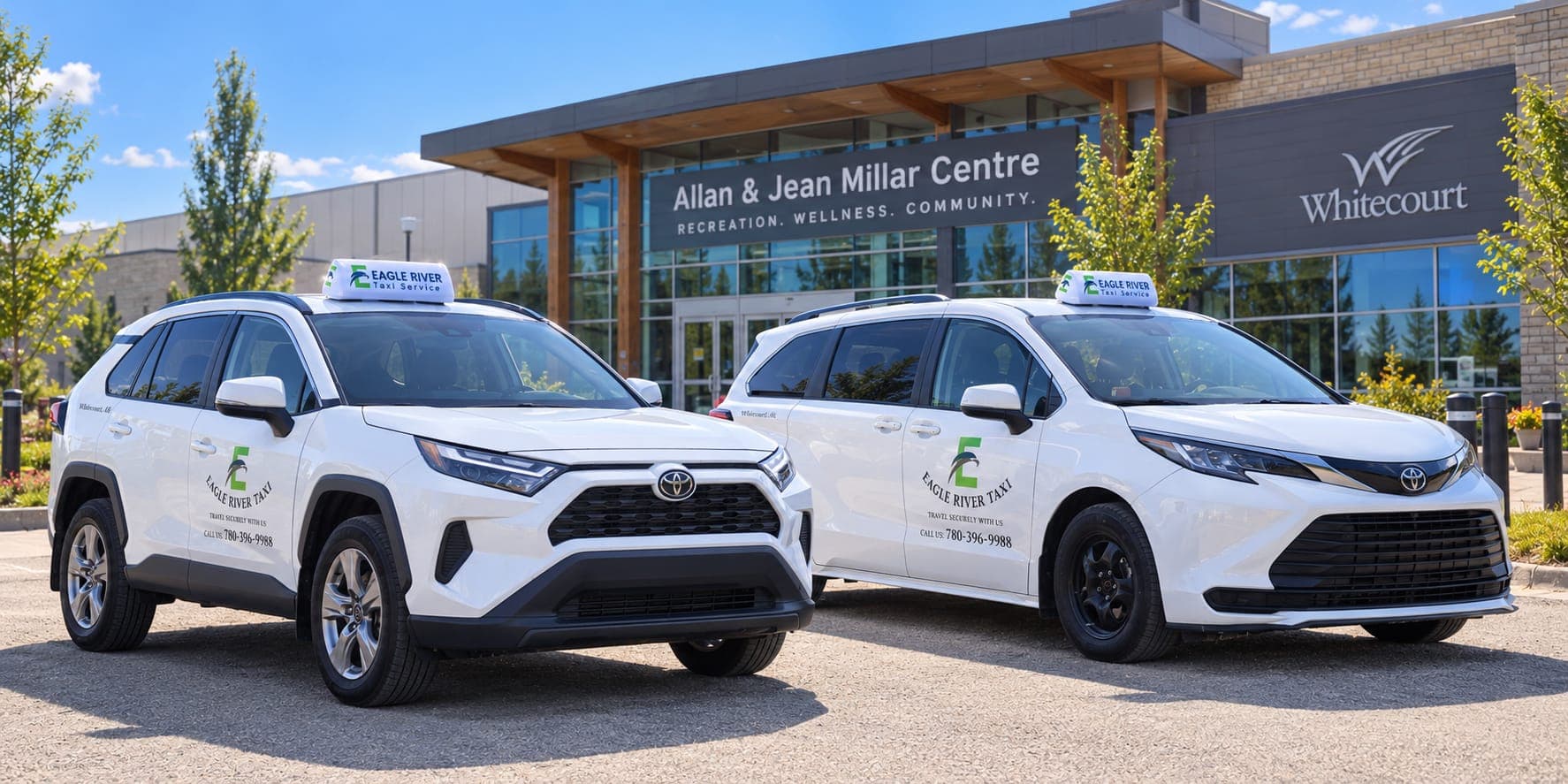 Two branded Eagle River Taxi vehicles outside the Allan and Jean Millar Centre.