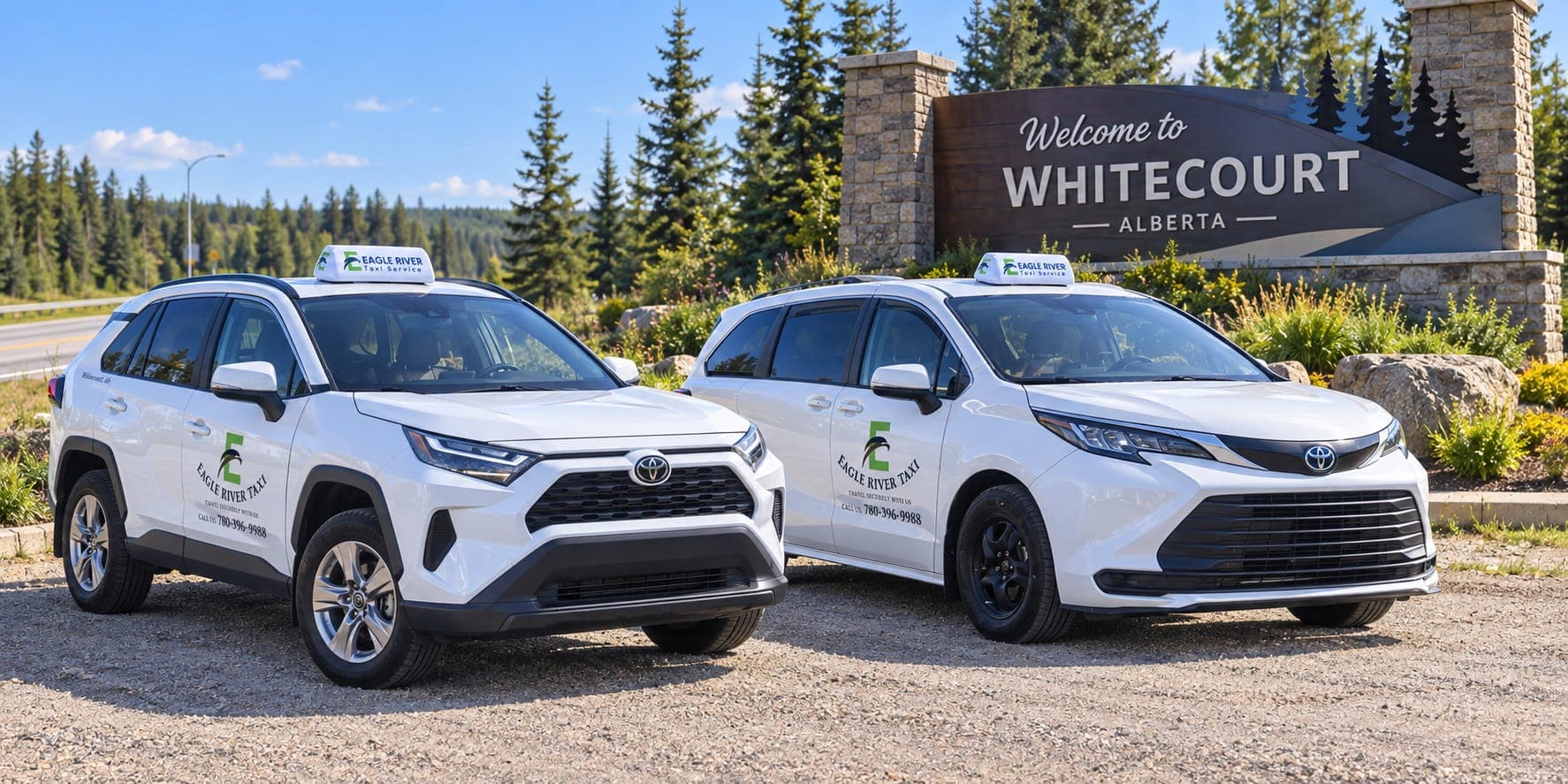 Branded Toyota RAV4 and Sienna beside the Welcome to Whitecourt sign.